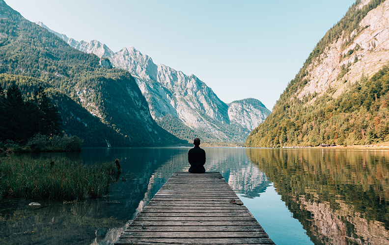 Person By Lake Reflecting